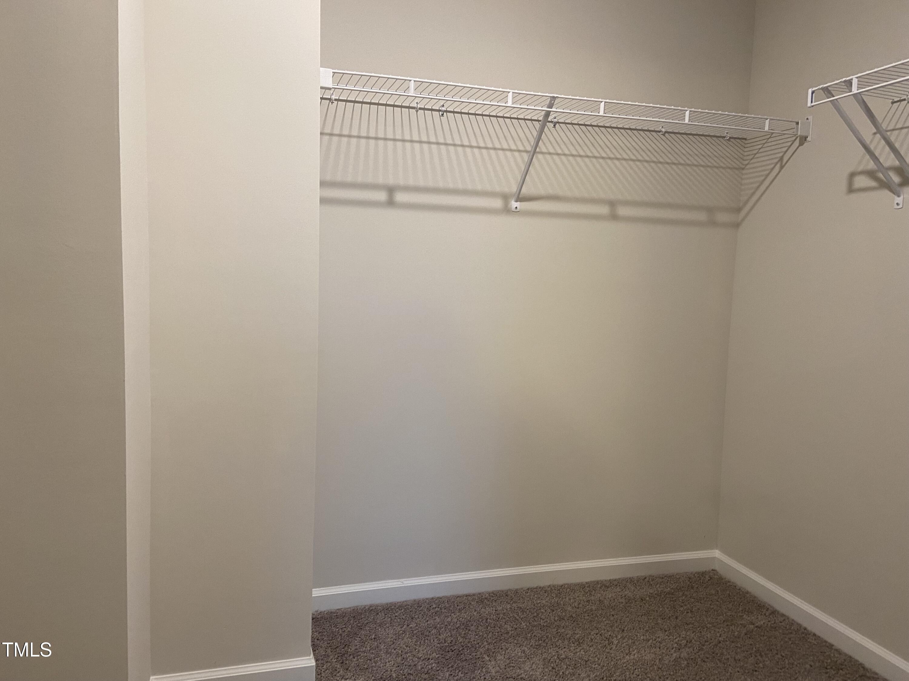 856 Patriot Summit Lane Apex, NC 27523 - Photo 17 of 25 a view of a room with racks on the wall