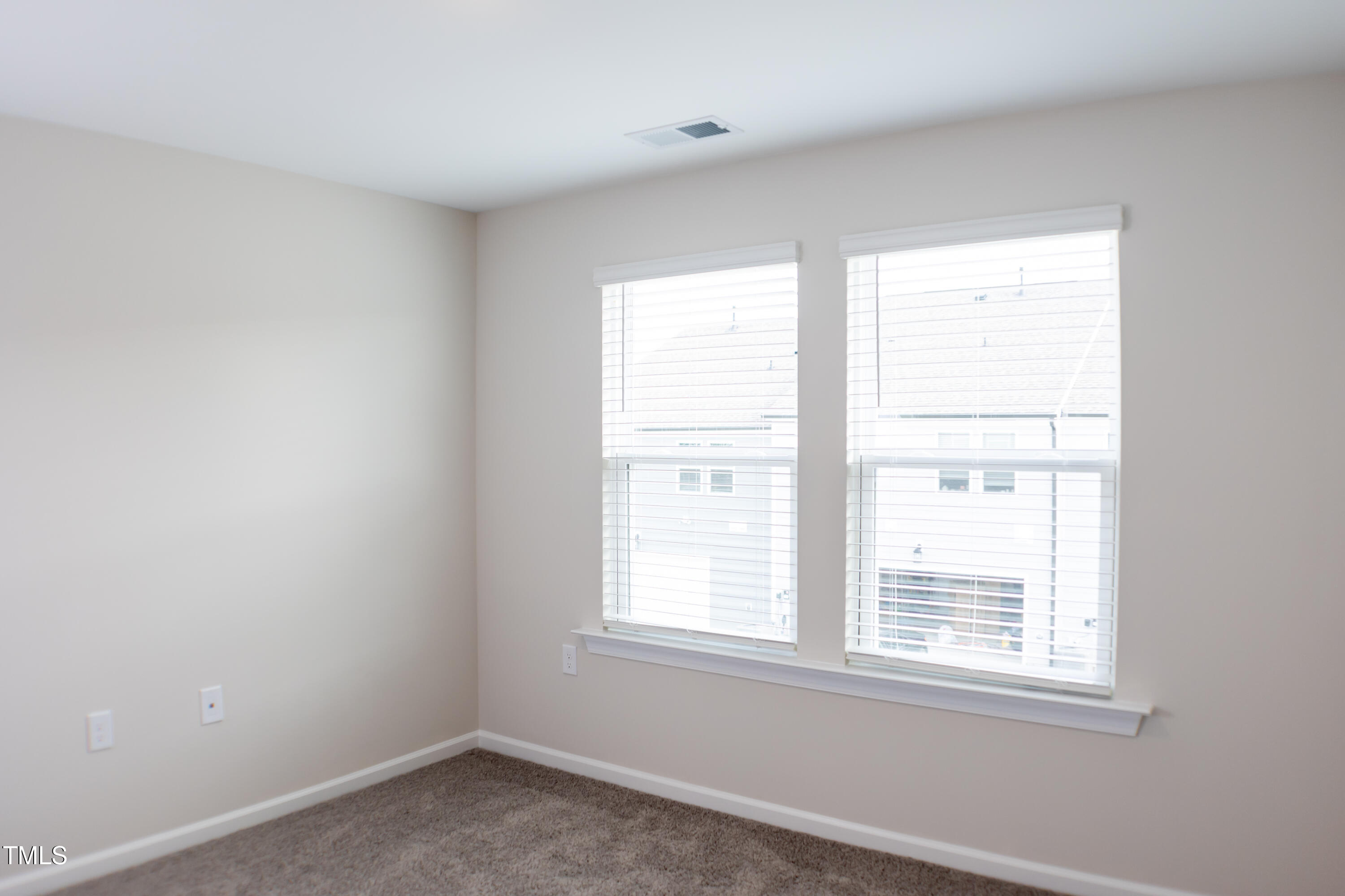 856 Patriot Summit Lane Apex, NC 27523 - Photo 20 of 25 an empty room with a window
