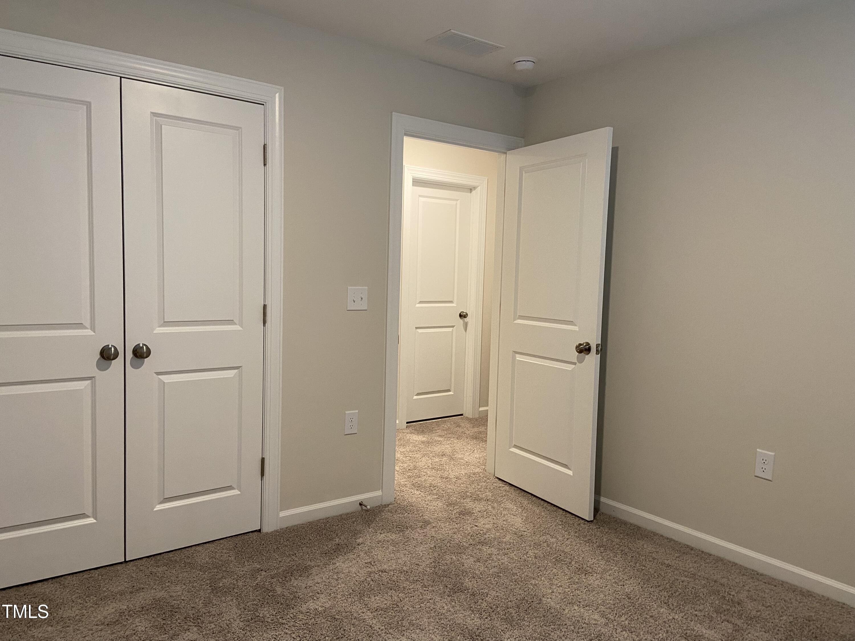 856 Patriot Summit Lane Apex, NC 27523 - Photo 21 of 25 an empty room with closet area