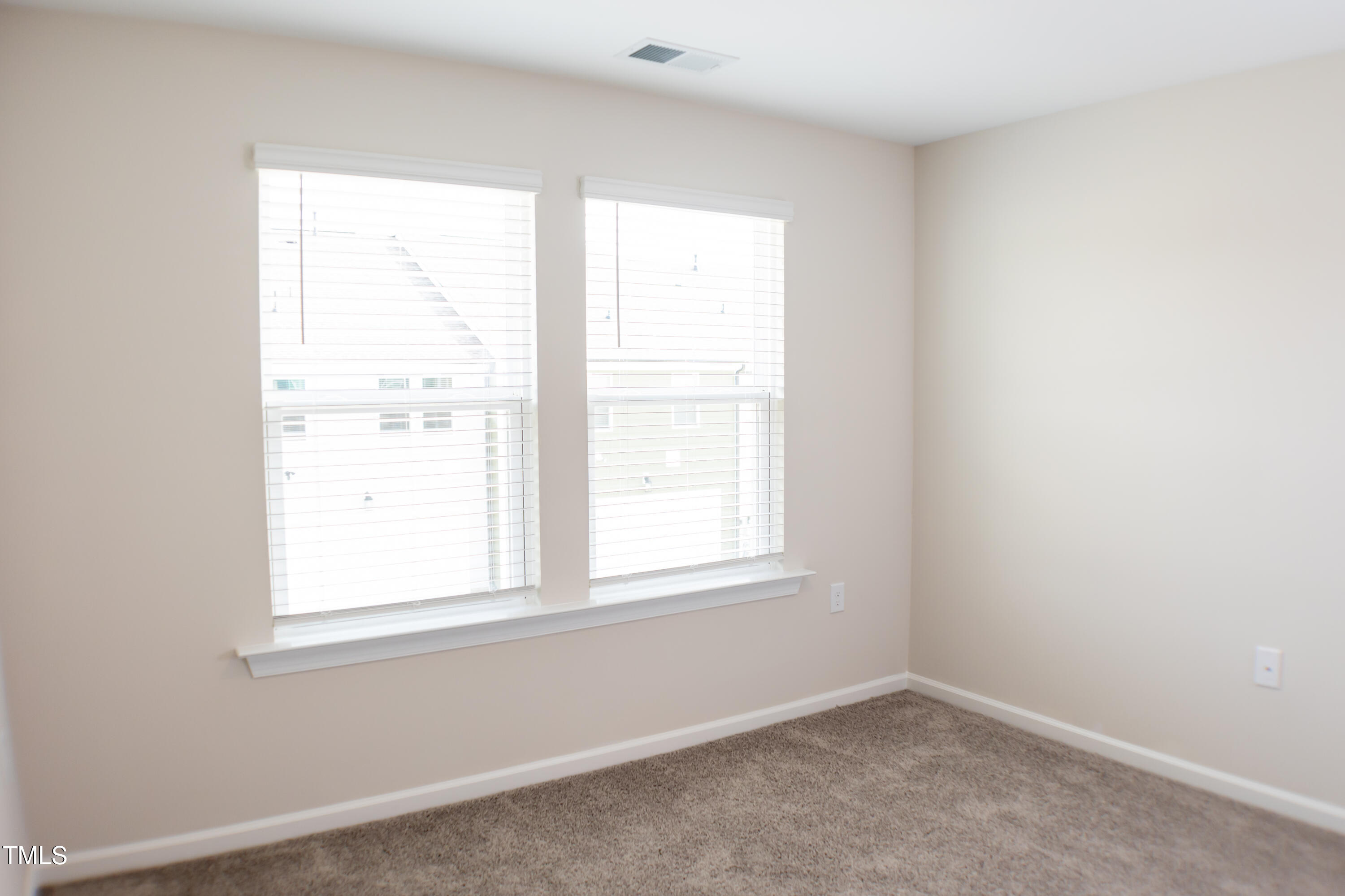 856 Patriot Summit Lane Apex, NC 27523 - Photo 22 of 25 an empty room with a window