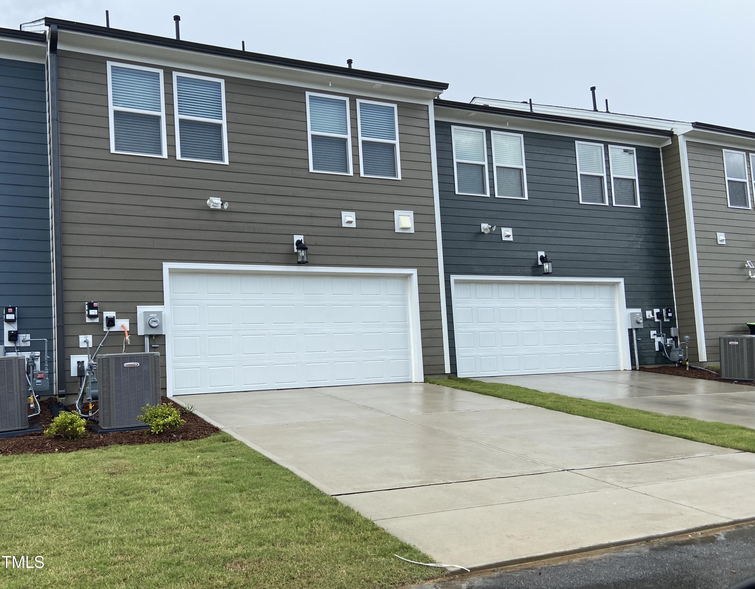 856 Patriot Summit Lane Apex, NC 27523 - Photo 25 of 25 a front view of a house with a yard and garage