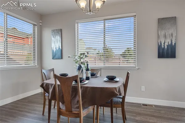 a view of a dining room with furniture and window