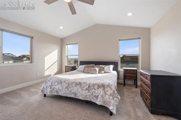 a bedroom with a bed and a fireplace