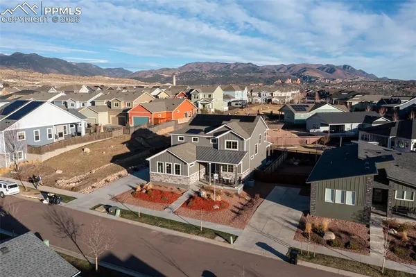 an aerial view of residential houses with outdoor space
