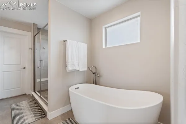 a bathroom with a glass shower door