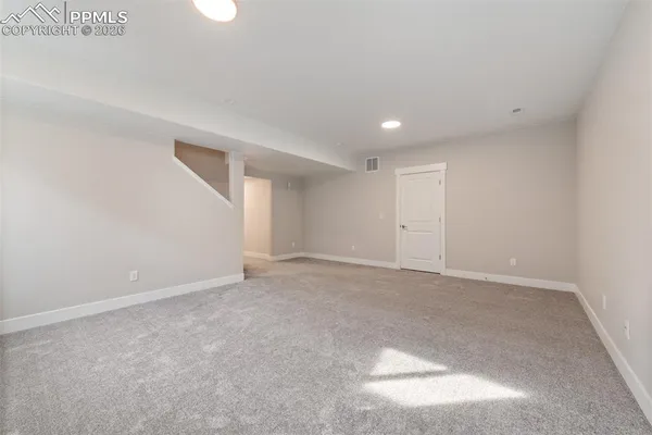 a room with a dresser and a window