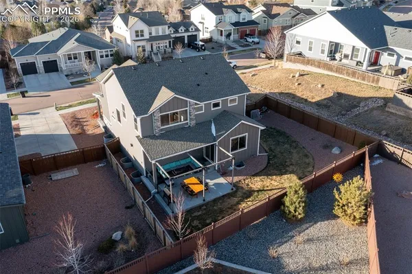 an aerial view of a house with a ocean view