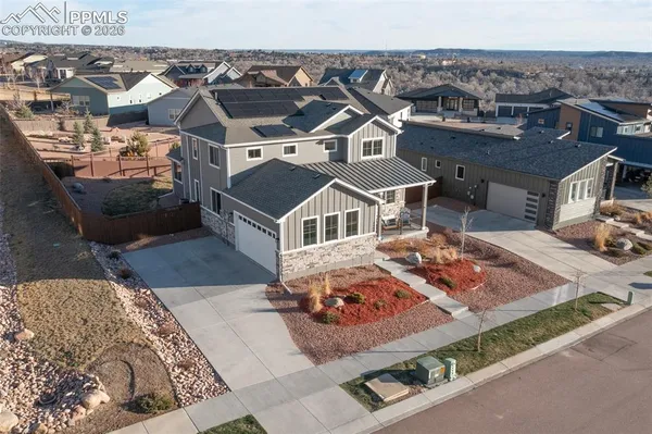 an aerial view of a house with a garden