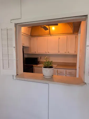 a room with a fireplace and a window