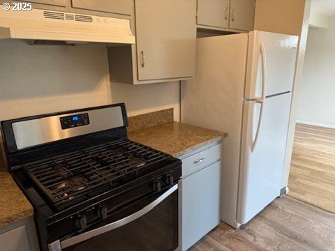4695 Fox Hollow Road Eugene, OR 97405 - Photo 5 of 9 a stove top oven sitting inside of a kitchen