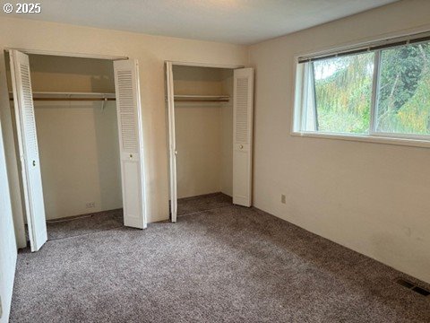 4695 Fox Hollow Road Eugene, OR 97405 - Photo 7 of 9 an empty room with windows and closet