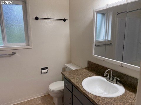 4695 Fox Hollow Road Eugene, OR 97405 - Photo 8 of 9 a bathroom with a granite countertop toilet sink and mirror
