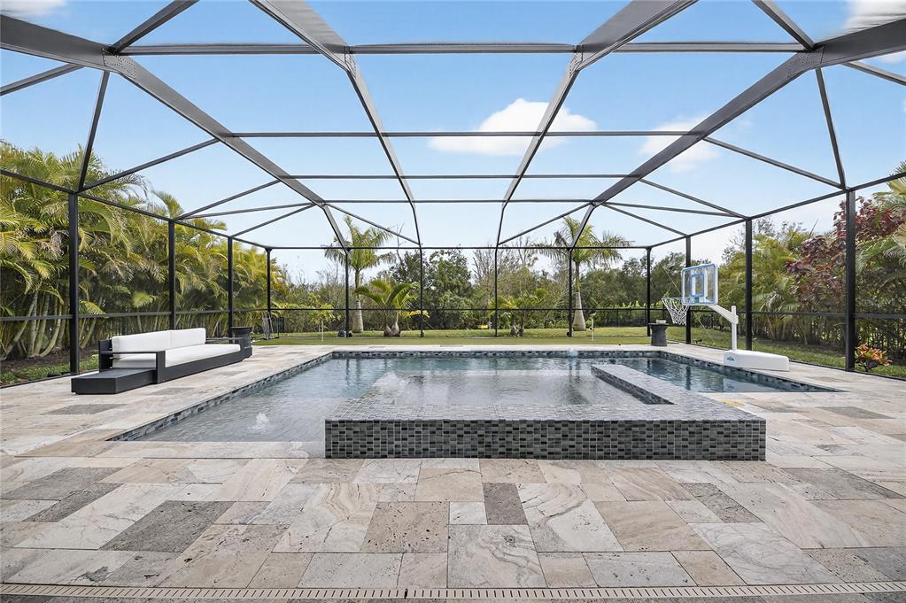 7424 Paradiso Drive Apollo Beach, FL 33572 - Photo 13 of 99 a view of a swimming pool with a patio