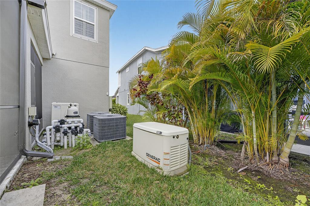 7424 Paradiso Drive Apollo Beach, FL 33572 - Photo 20 of 99 a view of a patio with table and chairs and potted plants