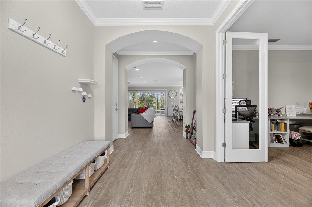 7424 Paradiso Drive Apollo Beach, FL 33572 - Photo 27 of 99 a view of a hallway view with living room and wooden floor