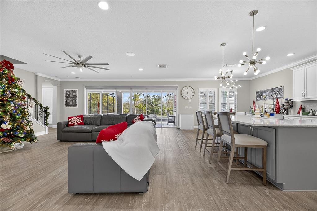 7424 Paradiso Drive Apollo Beach, FL 33572 - Photo 33 of 99 a living room with furniture kitchen and a chandelier