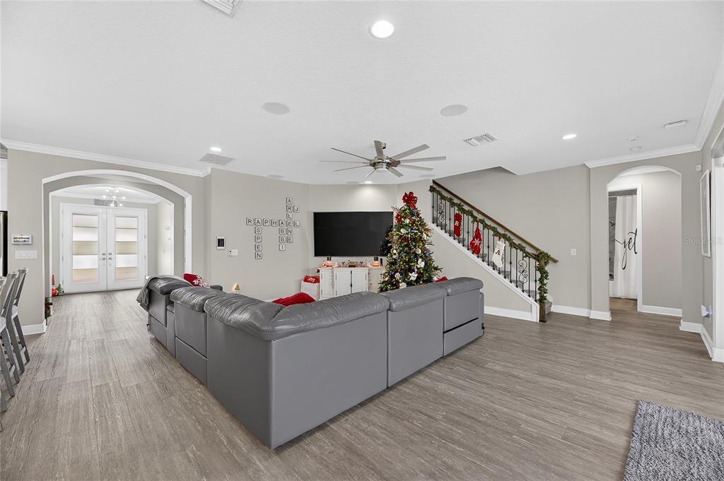 7424 Paradiso Drive Apollo Beach, FL 33572 - Photo 36 of 99 a living room with furniture and a flat screen tv