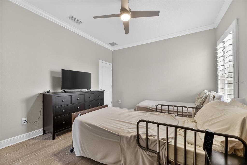 7424 Paradiso Drive Apollo Beach, FL 33572 - Photo 55 of 99 a bedroom with a bed and a flat screen tv