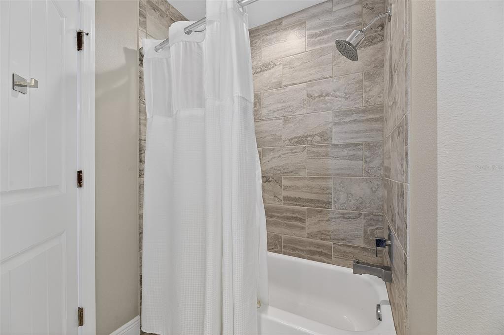 7424 Paradiso Drive Apollo Beach, FL 33572 - Photo 74 of 99 a bathroom with a shower
