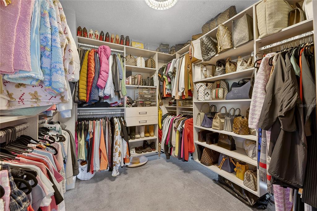 7424 Paradiso Drive Apollo Beach, FL 33572 - Photo 86 of 99 a view of walk in closet with clothes and shoes