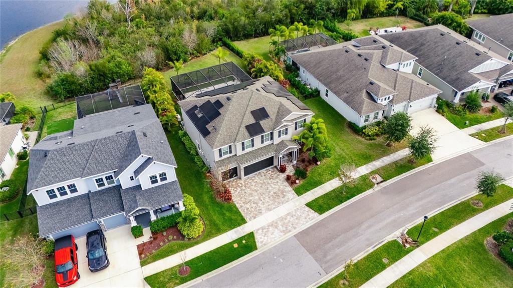 7424 Paradiso Drive Apollo Beach, FL 33572 - Photo 99 of 99 an aerial view of a house with a garden and outdoor seating