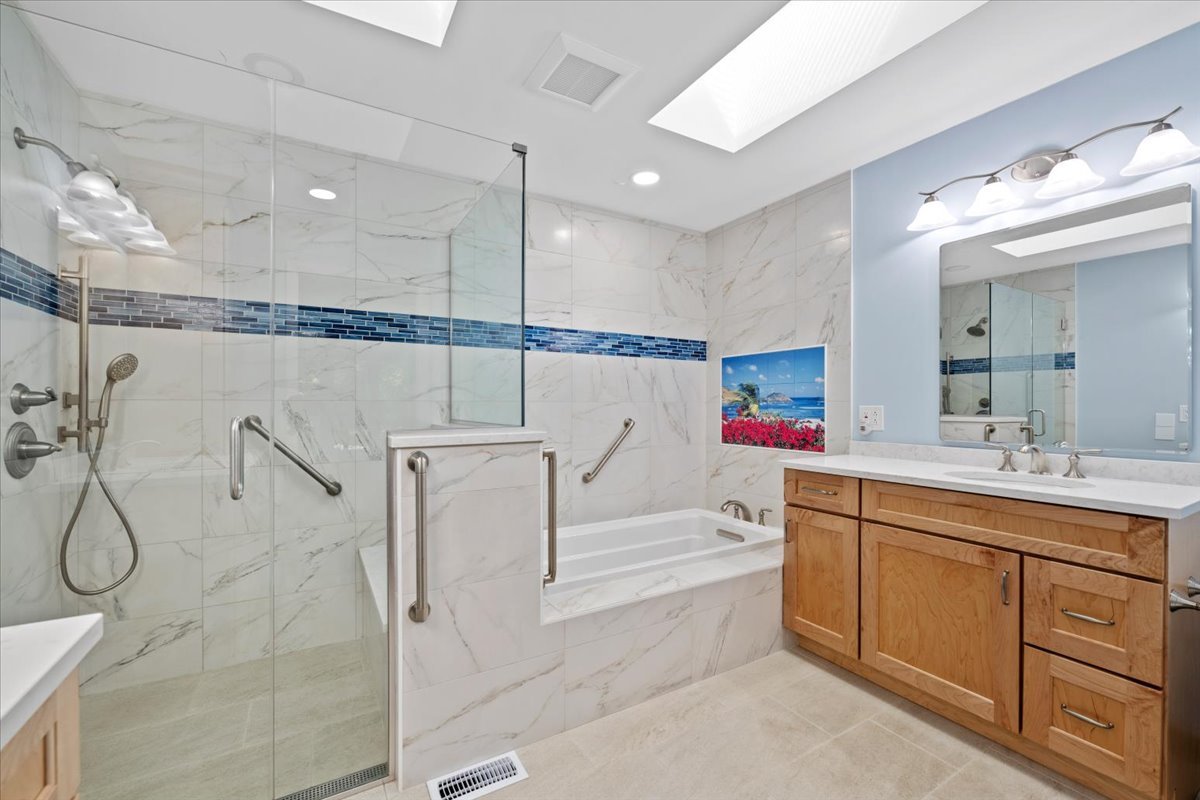 5N380 Ronsu Lane St. Charles, IL 60175 - Photo 30 of 48 a bathroom with a tub a sink and mirrors