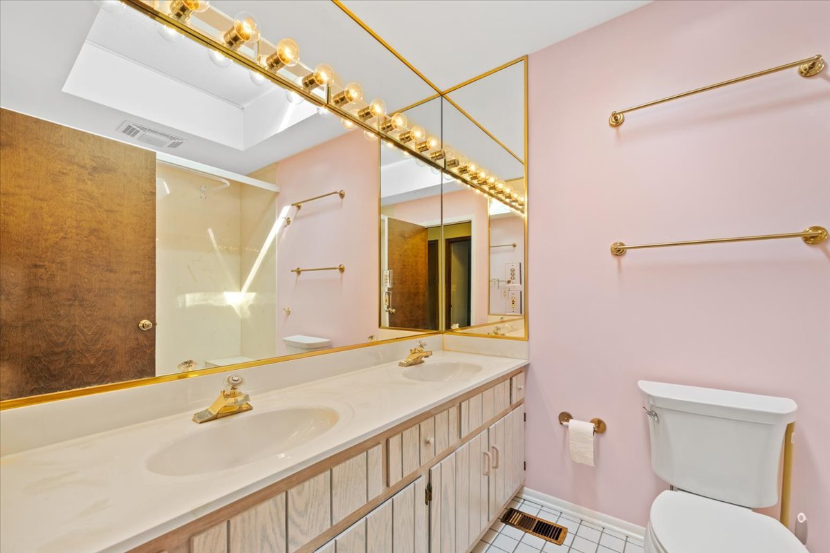 5N380 Ronsu Lane St. Charles, IL 60175 - Photo 32 of 48 a bathroom with a sink and a mirror