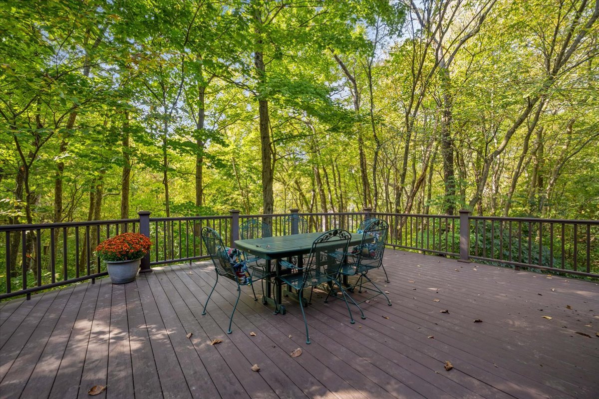 5N380 Ronsu Lane St. Charles, IL 60175 - Photo 36 of 48 a view of a roof deck with table and chairs a barbeque with wooden floor and fence