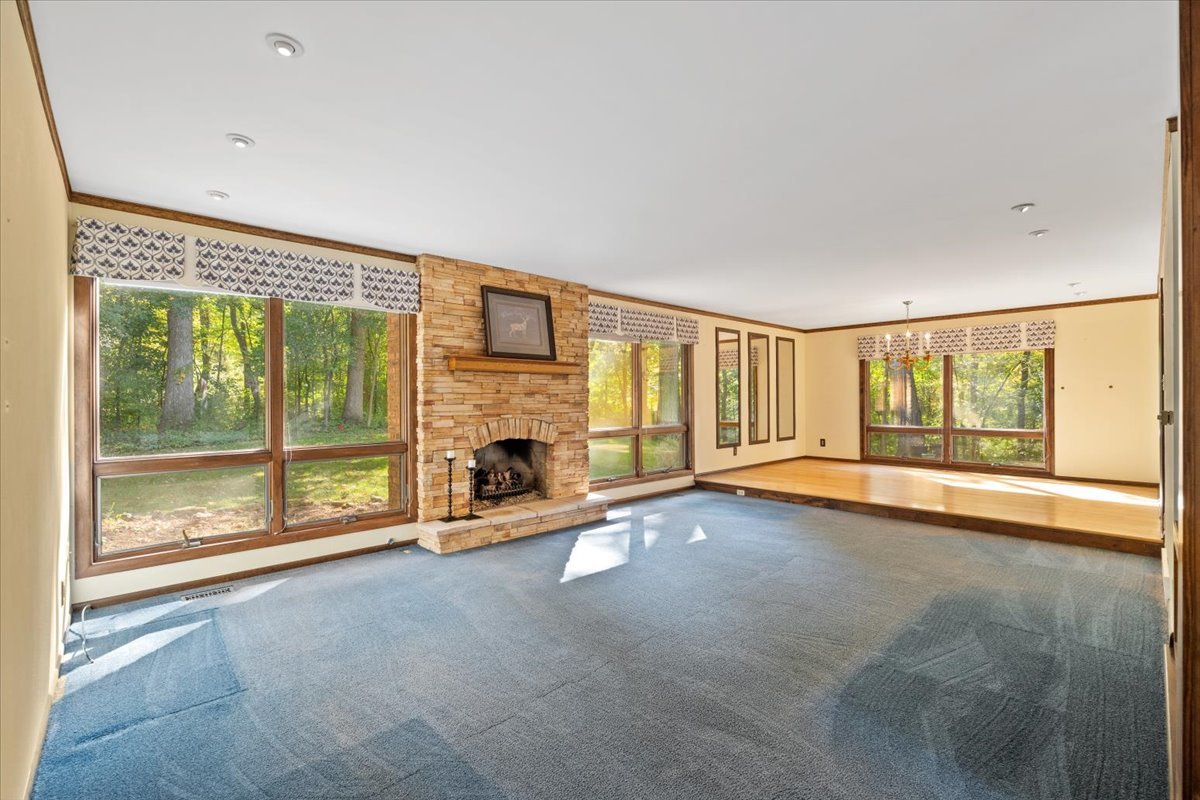 5N380 Ronsu Lane St. Charles, IL 60175 - Photo 8 of 48 a view of an empty room with a fireplace and a window