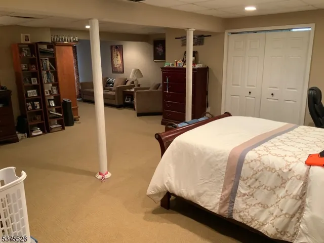 a bedroom with a bed and a walk in closet