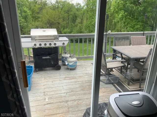 a view of balcony with couch and wooden floor