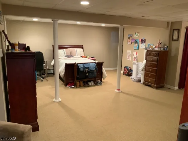 a bedroom with furniture and closet
