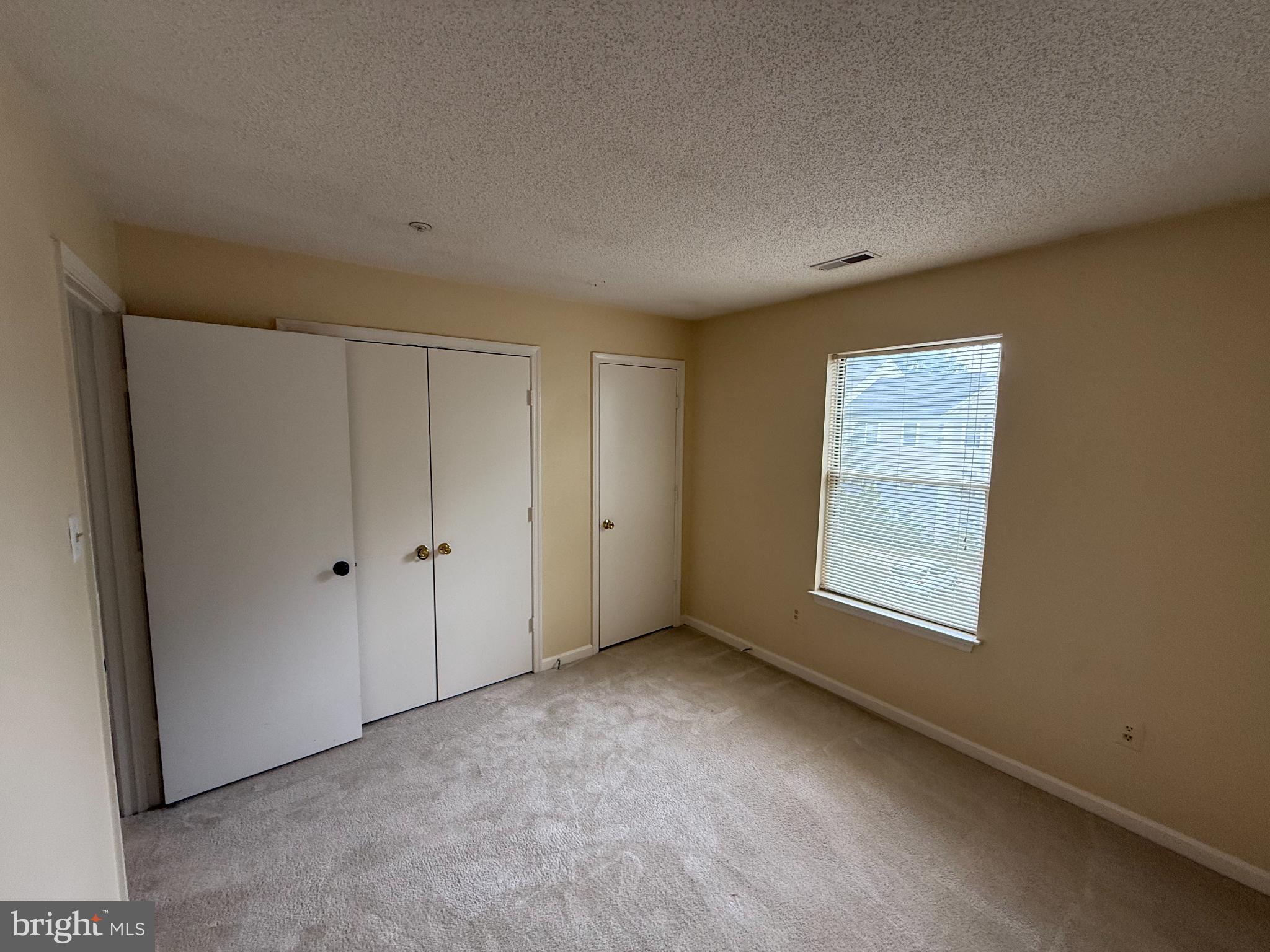2600 Camelback Lane, Unit 9 Silver Spring, MD 20906 - Photo 11 of 16 Bright and inviting empty bedroom space.