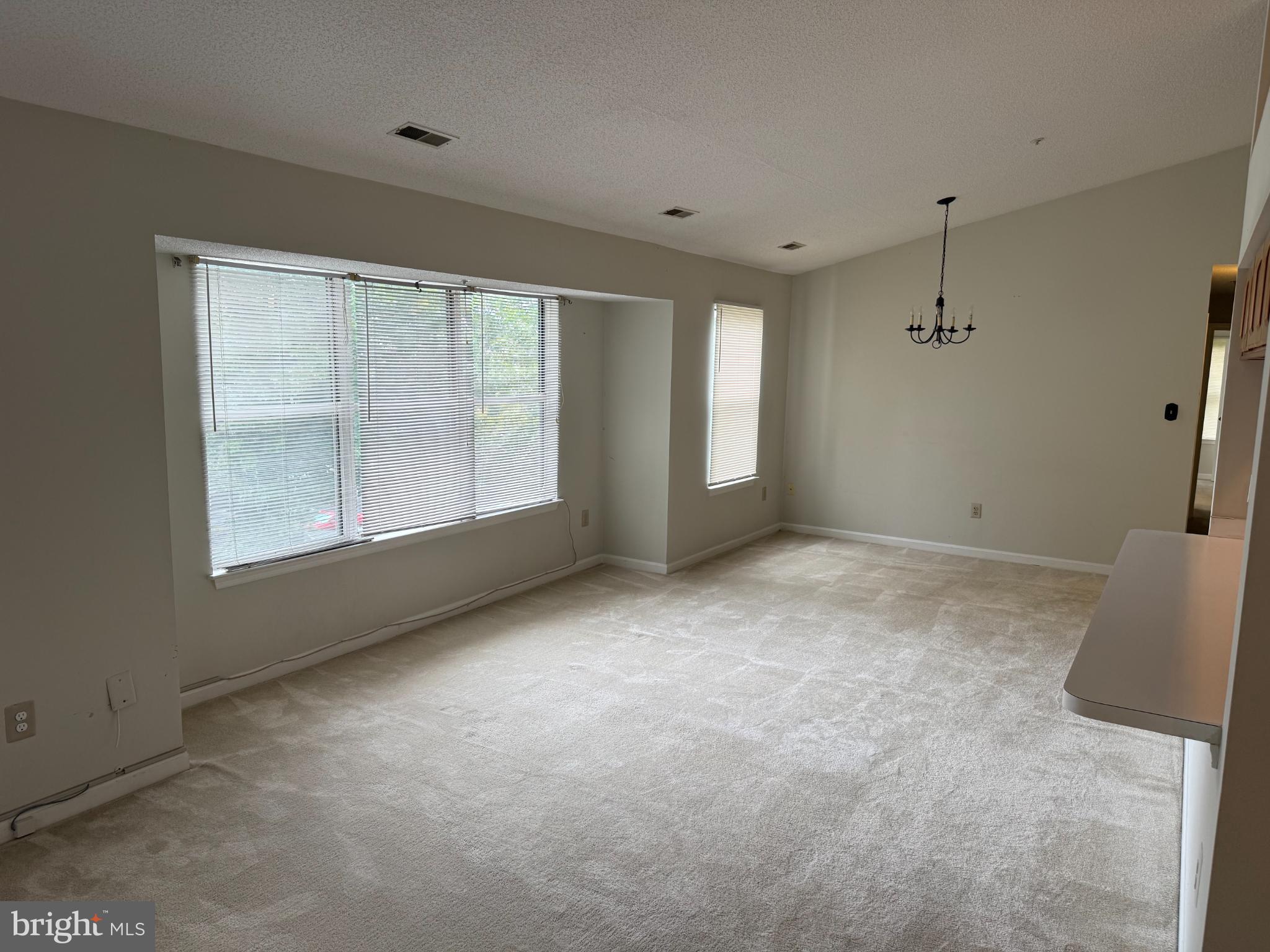 2600 Camelback Lane, Unit 9 Silver Spring, MD 20906 - Photo 7 of 16 Spacious, light-filled living area awaits you.