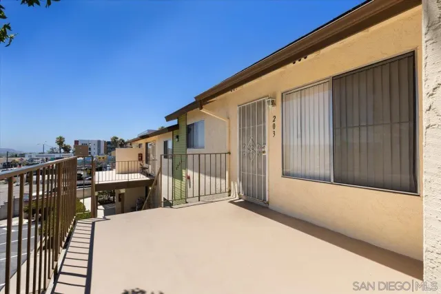 a view of balcony with wooden floor and stairs