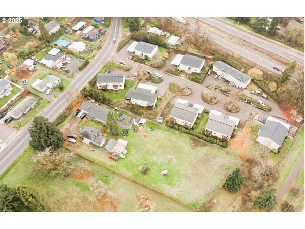 an aerial view of residential houses with outdoor space