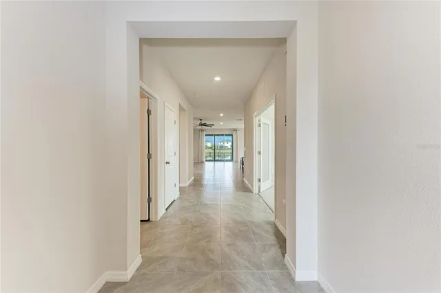 a large kitchen with stainless steel appliances granite countertop a large counter top and a stove top oven