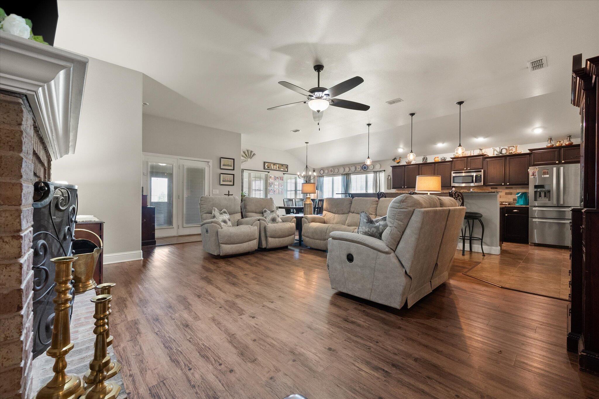 3106 128th Street Lubbock, TX 79423 - Photo 11 of 44 a living room with furniture and a view of kitchen