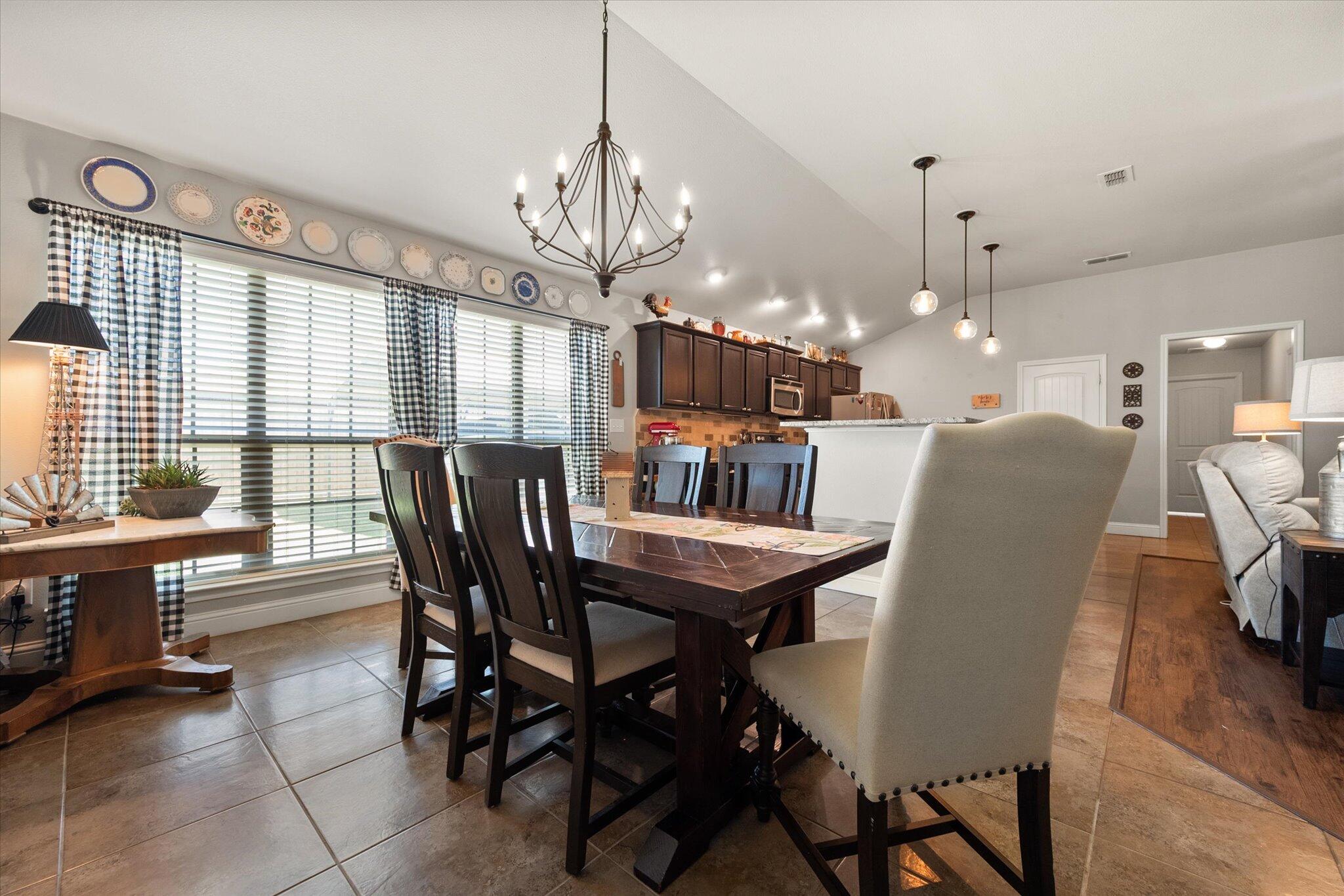 3106 128th Street Lubbock, TX 79423 - Photo 19 of 44 a view of a dining room with furniture window and outside view