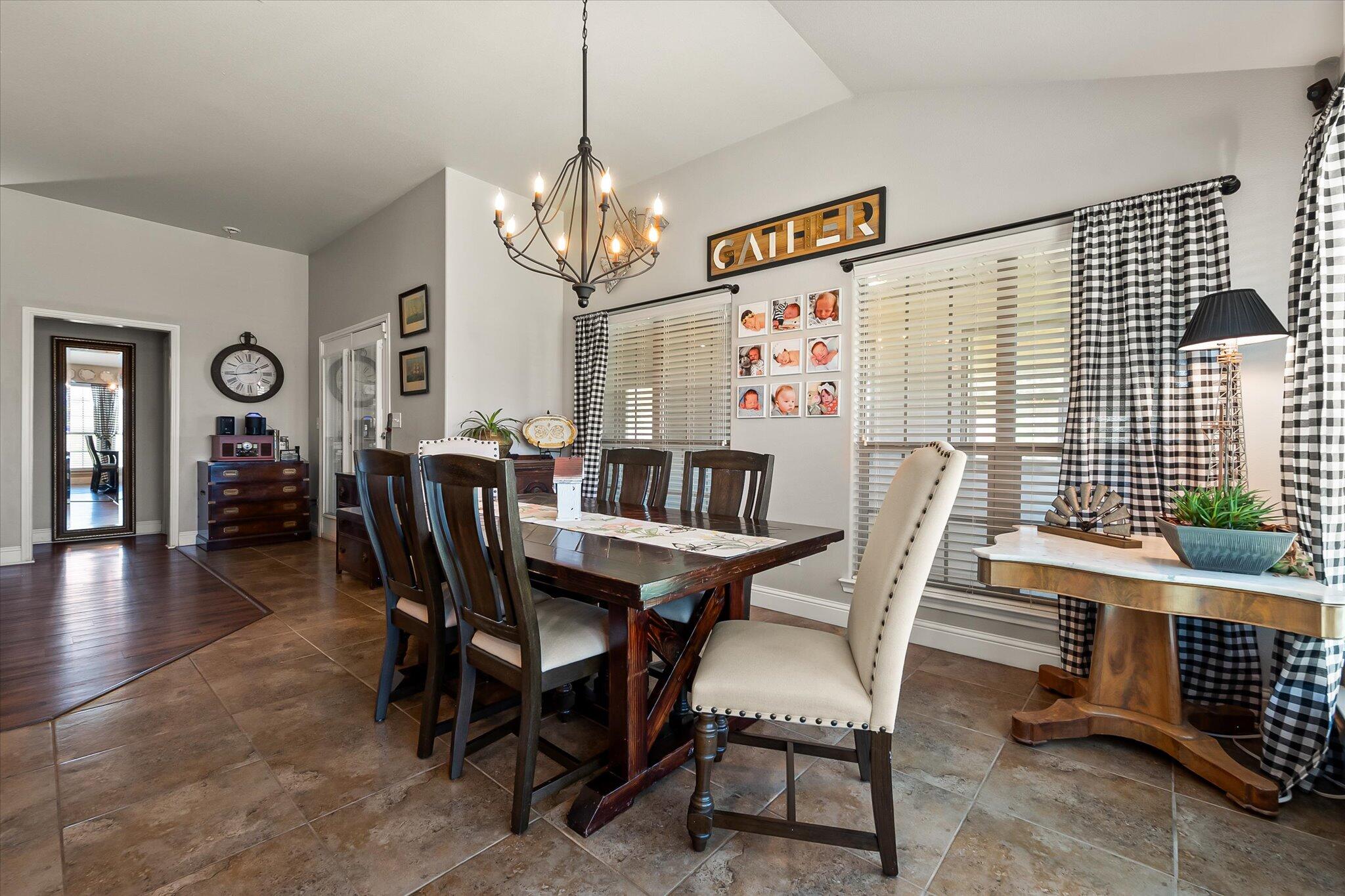 3106 128th Street Lubbock, TX 79423 - Photo 20 of 44 a view of a dining room with furniture window and wooden floor