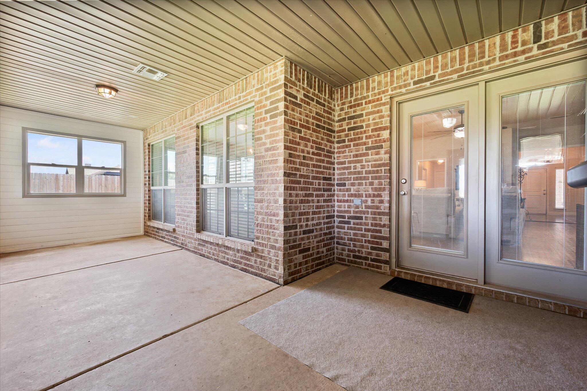 3106 128th Street Lubbock, TX 79423 - Photo 35 of 44 an empty room with large windows