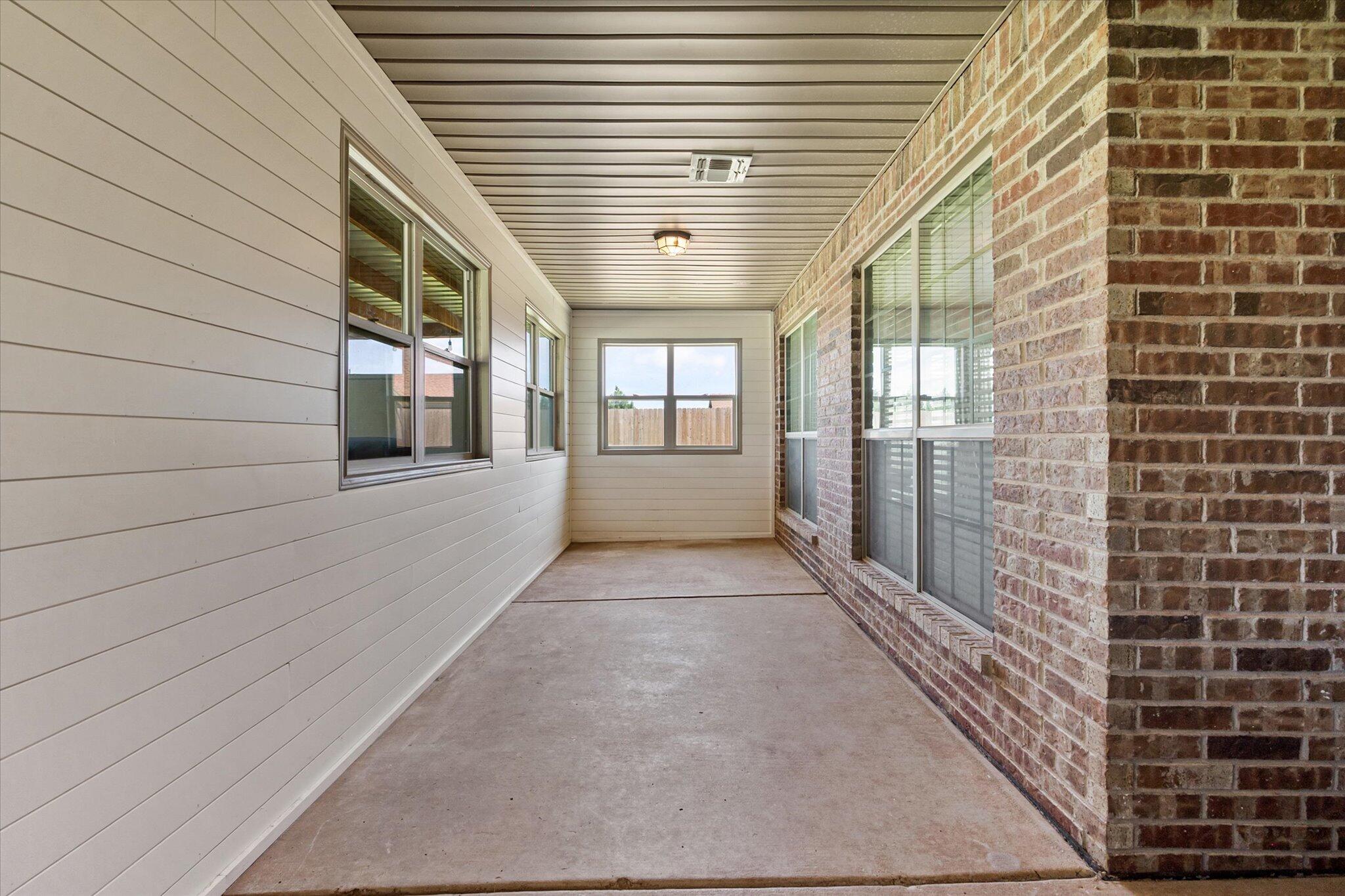 3106 128th Street Lubbock, TX 79423 - Photo 37 of 44 a view of a pathway both side of building