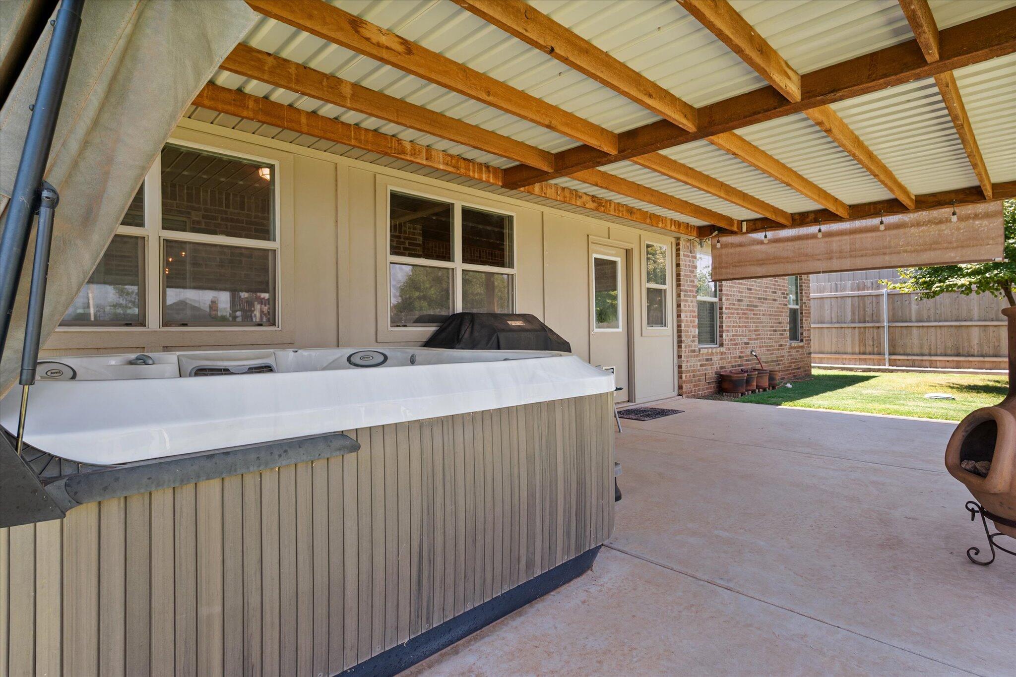3106 128th Street Lubbock, TX 79423 - Photo 39 of 44 a swimming pool with barbeque in front of it
