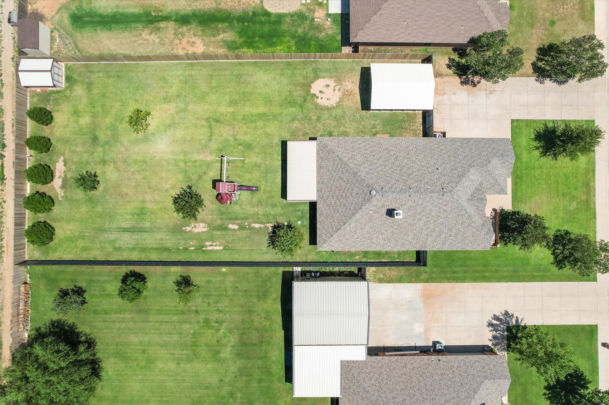 3106 128th Street Lubbock, TX 79423 - Photo 4 of 44 an aerial view of residential houses with outdoor space and swimming pool