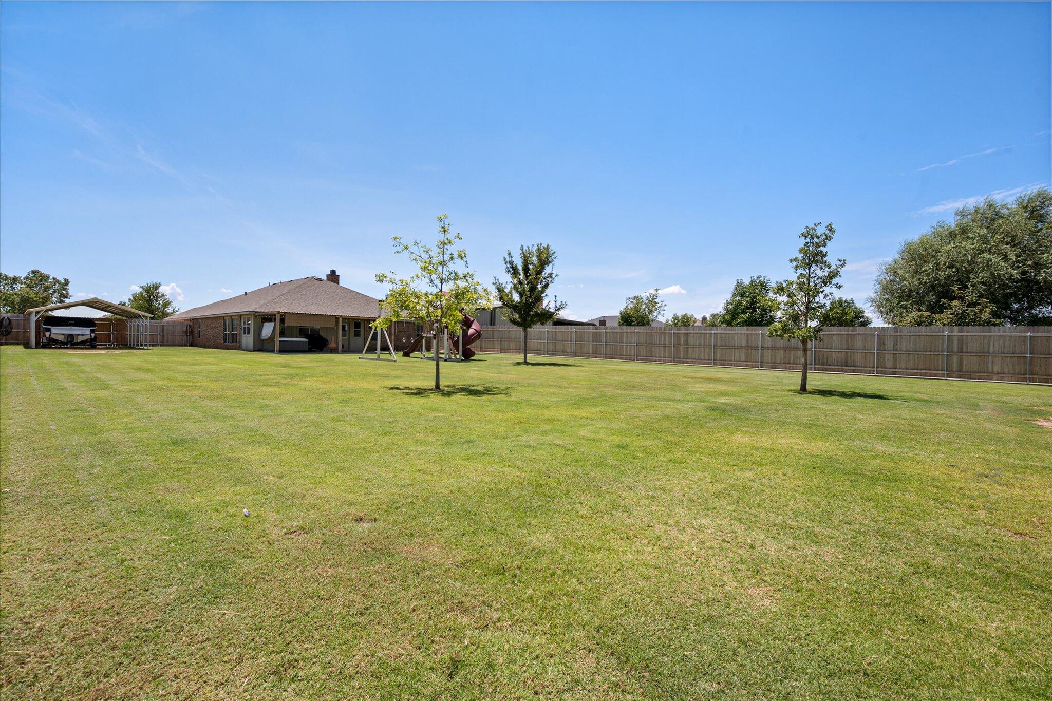 3106 128th Street Lubbock, TX 79423 - Photo 42 of 44 a view of a garden with a house