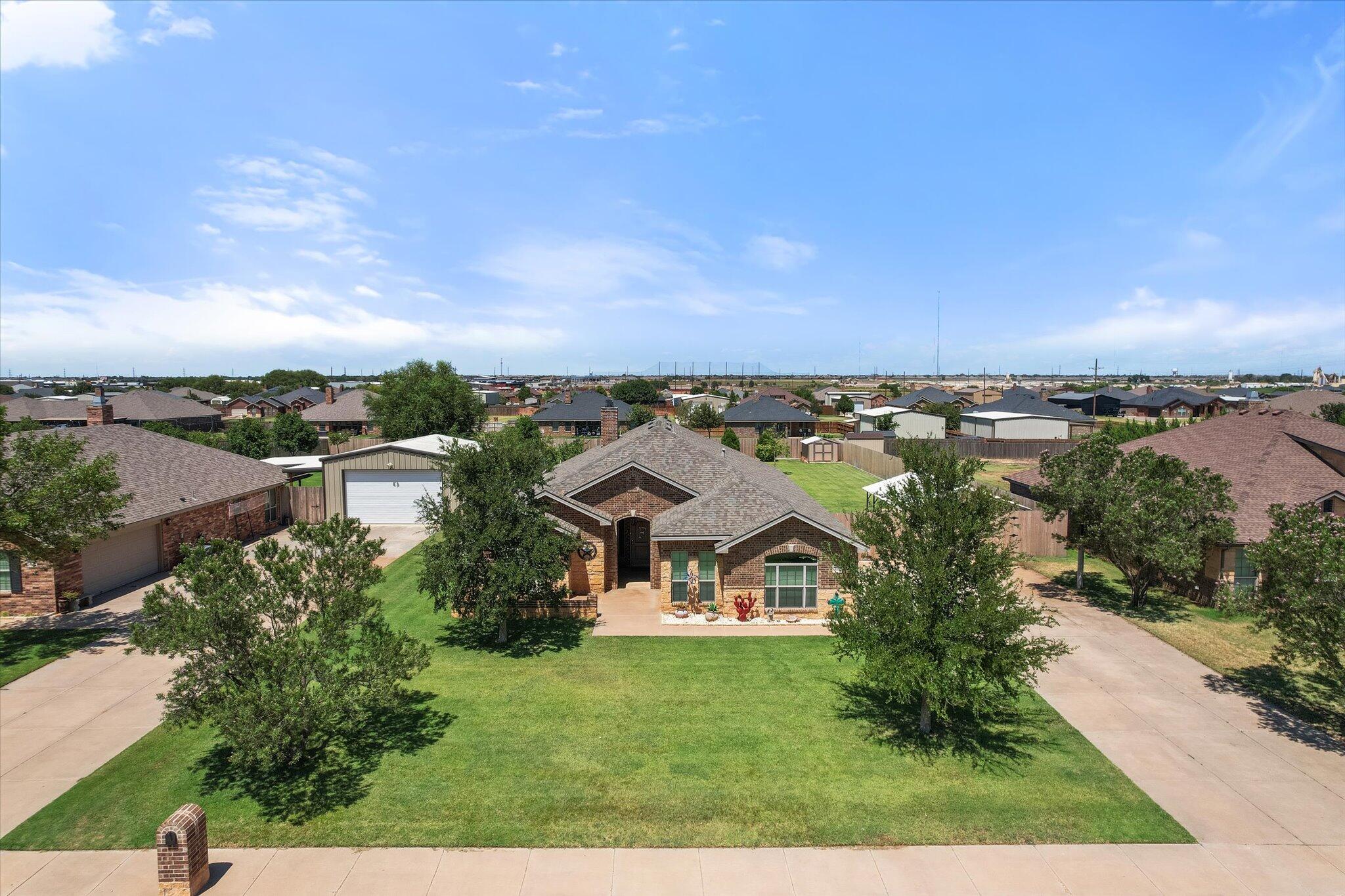 3106 128th Street Lubbock, TX 79423 - Photo 44 of 44 an aerial view of a house with a garden