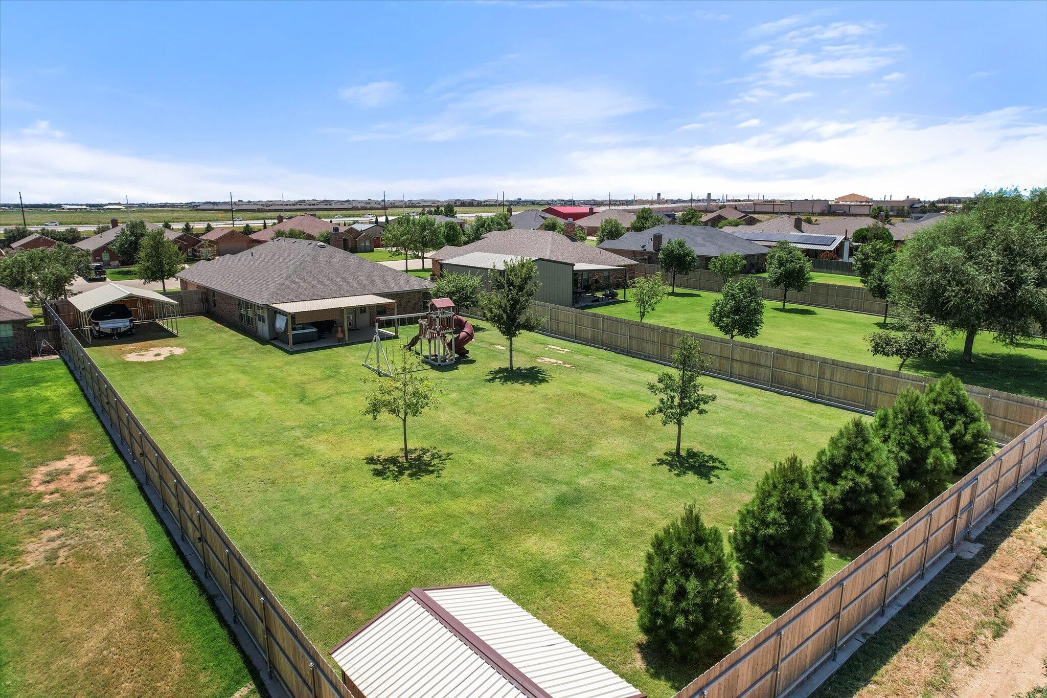 3106 128th Street Lubbock, TX 79423 - Photo 5 of 44 a view of swimming pool from a balcony