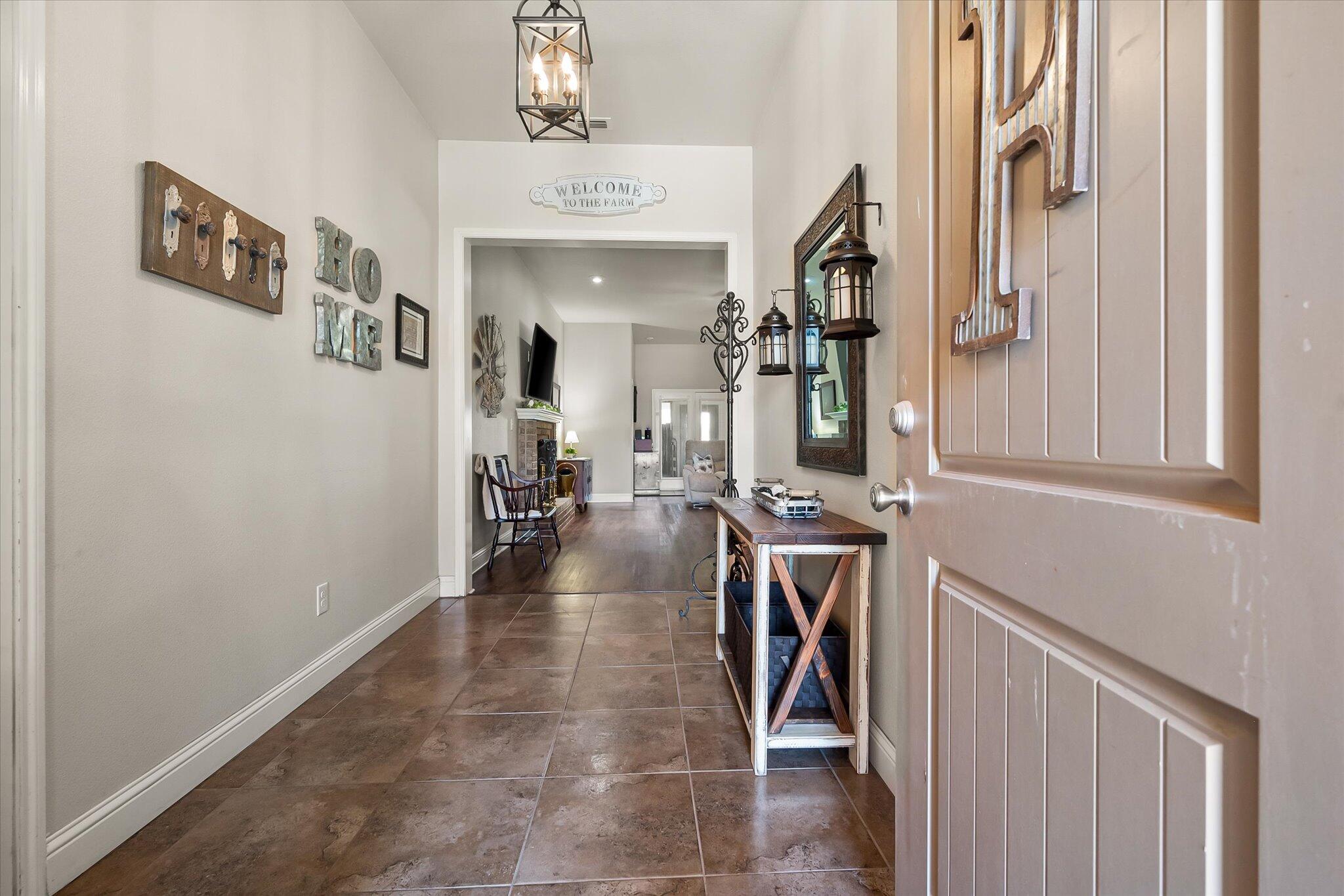 3106 128th Street Lubbock, TX 79423 - Photo 6 of 44 a view of a livingroom with furniture and stairs
