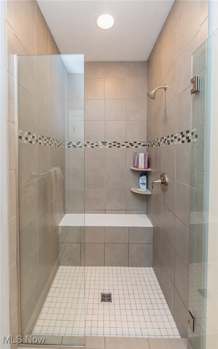 2041 Jaycox Road Avon, OH 44011 - Photo 32 of 50 Full bath with a stall shower, a textured ceiling, and recessed lighting