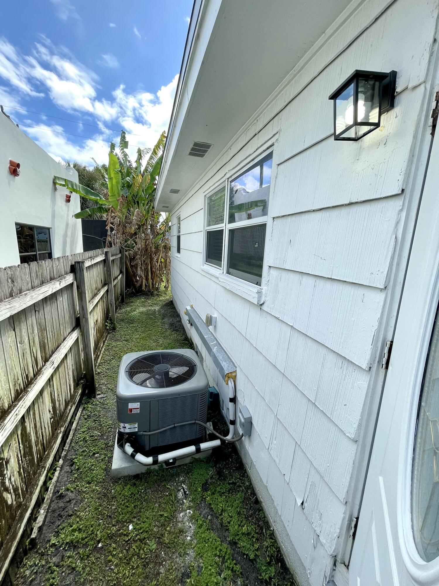 640 54th Street, Unit A West Palm Beach, FL 33407 - Photo 13 of 13 a backyard of a house with garden and outdoor seating